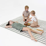 Full view of children playing on spacious striped floor mat – toddlekind portable water resistant wander grande play mat forest for family play area