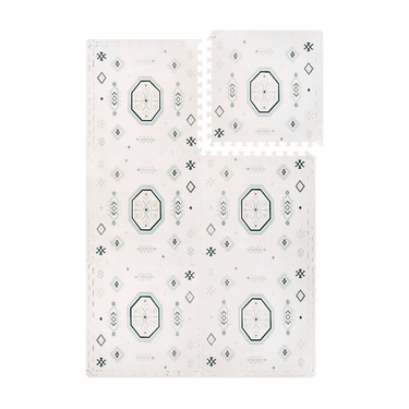 Interlocking foam tiles with one tile lifted to show puzzle edges of the toddlekind baby toddler foam modern designer puzzle play mat haven amira seagrass.