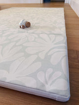 Detailed corner view of toddlekind baby toddler foldable foam cushioned tumble play mat willow frost showing soft padding and design.