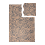 Interlocking foam tiles with one tile lifted to show puzzle edges of the toddlekind baby toddler foam modern designer puzzle play mat haven wild driftwood.