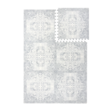 Interlocking foam tiles arranged together and one tile separated to show puzzle edges of the toddlekind baby toddler foam modern designer puzzle play mat haven parisa pearl blue.