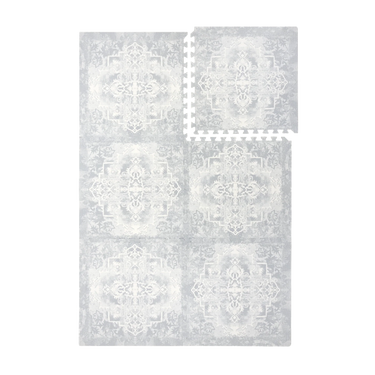 Interlocking foam tiles arranged together and one tile separated to show puzzle edges of the toddlekind baby toddler foam modern designer puzzle play mat haven parisa pearl blue.