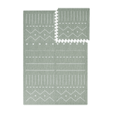 Interlocking green foam tiles with one tile removed from toddlekind baby toddler foam modern designer puzzle play mat haven berber moss.