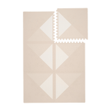 Interlocking neutral tiles with one tile removed from toddlekind baby toddler foam modern designer puzzle play mat haven kyte mocha.