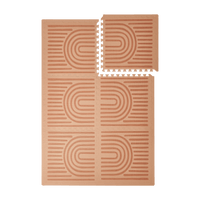 Interlocking tiles arranged in a grid with one corner lifted showing the toddlekind baby toddler foam modern designer puzzle play mat haven linear camel.
