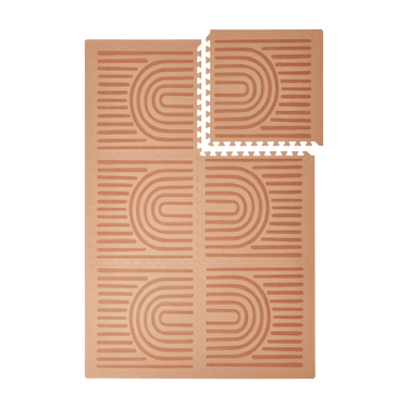 Interlocking tiles arranged in a grid with one corner lifted showing the toddlekind baby toddler foam modern designer puzzle play mat haven linear camel.