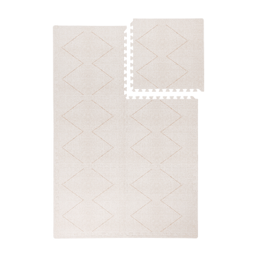 Interlocking tiles arranged in a grid with one piece lifted showing the toddlekind baby toddler foam modern designer puzzle play mat haven tulum bone.