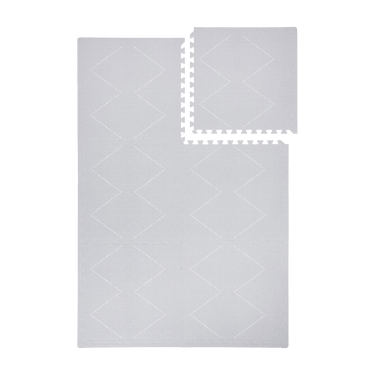 Interlocking tile layout with one piece removed showing the toddlekind baby toddler foam modern designer puzzle play mat haven tulum stone.