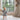 Baby toddler walking barefoot holding a toy in a sunlit room on the toddlekind baby toddler foam modern designer puzzle play mat haven linear linen.