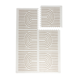 Interlocking foam tiles with one tile lifted to show puzzle edges of the toddlekind baby toddler foam modern designer puzzle play mat haven linear putty.