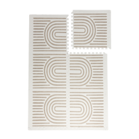 Interlocking foam tiles with one tile lifted to show puzzle edges of the toddlekind baby toddler foam modern designer puzzle play mat haven linear putty.