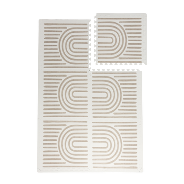 Interlocking foam tiles with one tile lifted to show puzzle edges of the toddlekind baby toddler foam modern designer puzzle play mat haven linear putty.
