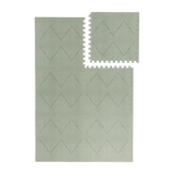Interlocking tile layout with one piece removed showing the toddlekind baby toddler foam modern designer puzzle play mat haven tulum agave.
