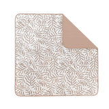 Flat lay of leaf-pattern play mat with corner fold detail – toddlekind portable water resistant wander classic play mat ocean tan showcasing reversible design. Alt Img