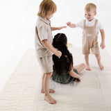 Three children playing together on soft padded mat – toddlekind portable water resistant wander grande play mat tofu for group playtime
