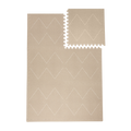 Interlocking tile layout with one piece removed showing the toddlekind baby toddler foam modern designer puzzle play mat haven tulum dessert caliza.