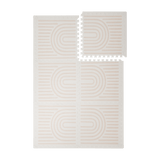 Interlocking foam tiles arranged in a grid with one corner lifted showing edges of the toddlekind baby toddler foam modern designer puzzle play mat haven linear linen.
