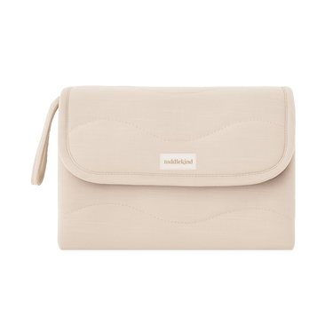 Closed toddlekind baby portable changing clutch mini maven blush with strap for convenient travel and storage.

