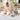 Mother and baby toddler sitting together indoors with cookies on the toddlekind baby toddler foam modern designer puzzle play mat haven linear linen.

