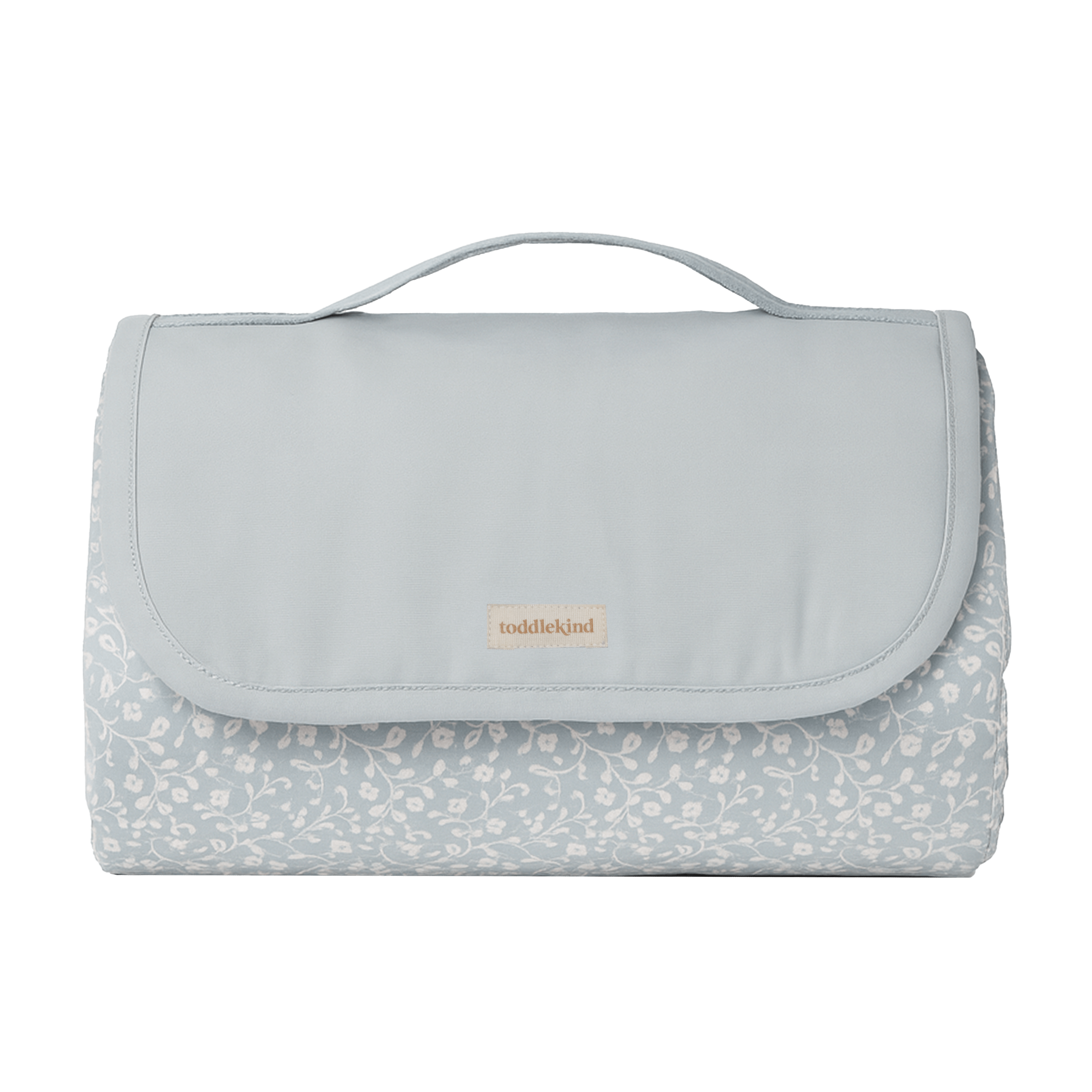 Folded and packed floral play mat with carry handle – toddlekind portable water resistant wander grande play mat for easy travel and storage. 
