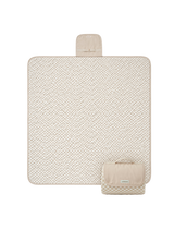 Flat lay product image of a floral play mat with a folded corner showing the underside, displaying the toddlekind portable water resistant wander classic play mat botanical earthen design and material. Alt Img